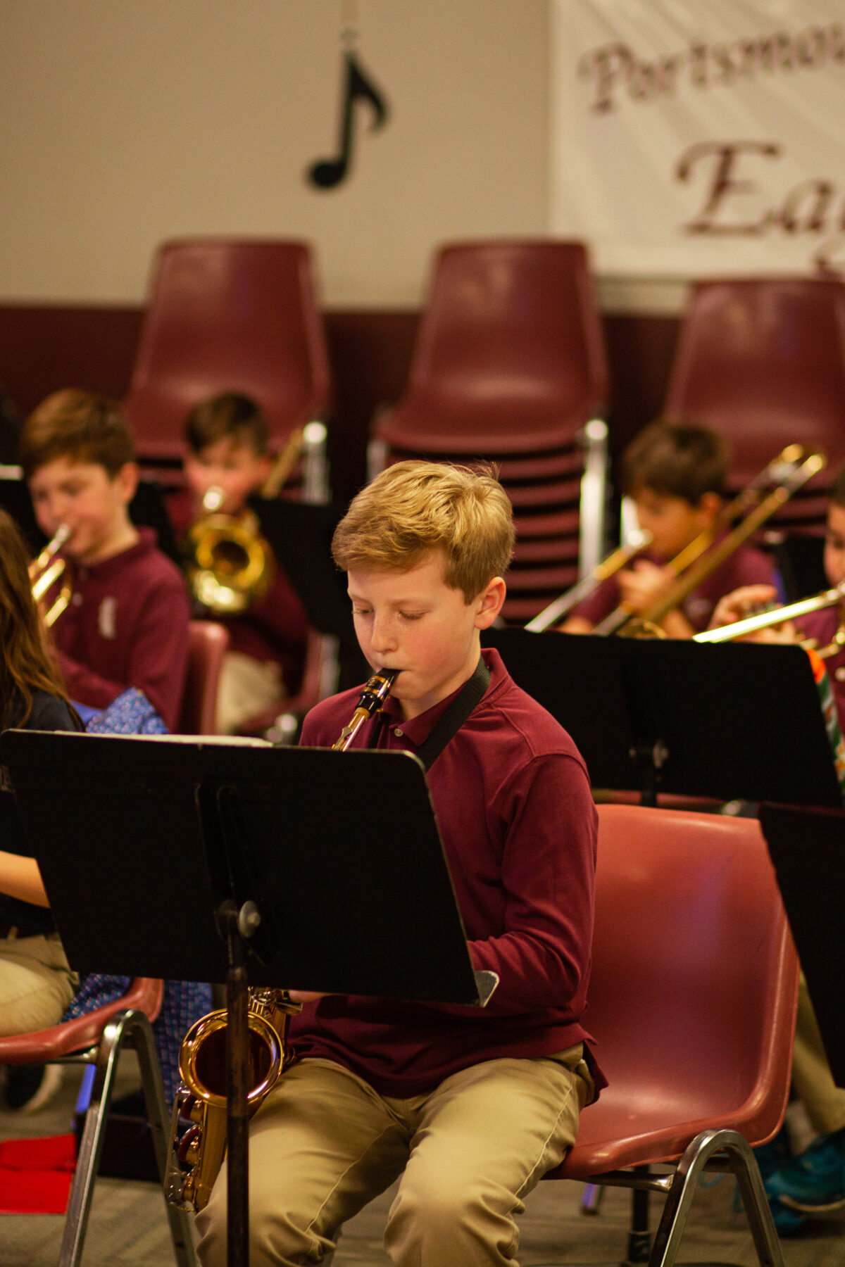 Group of students in music class playing different instruments