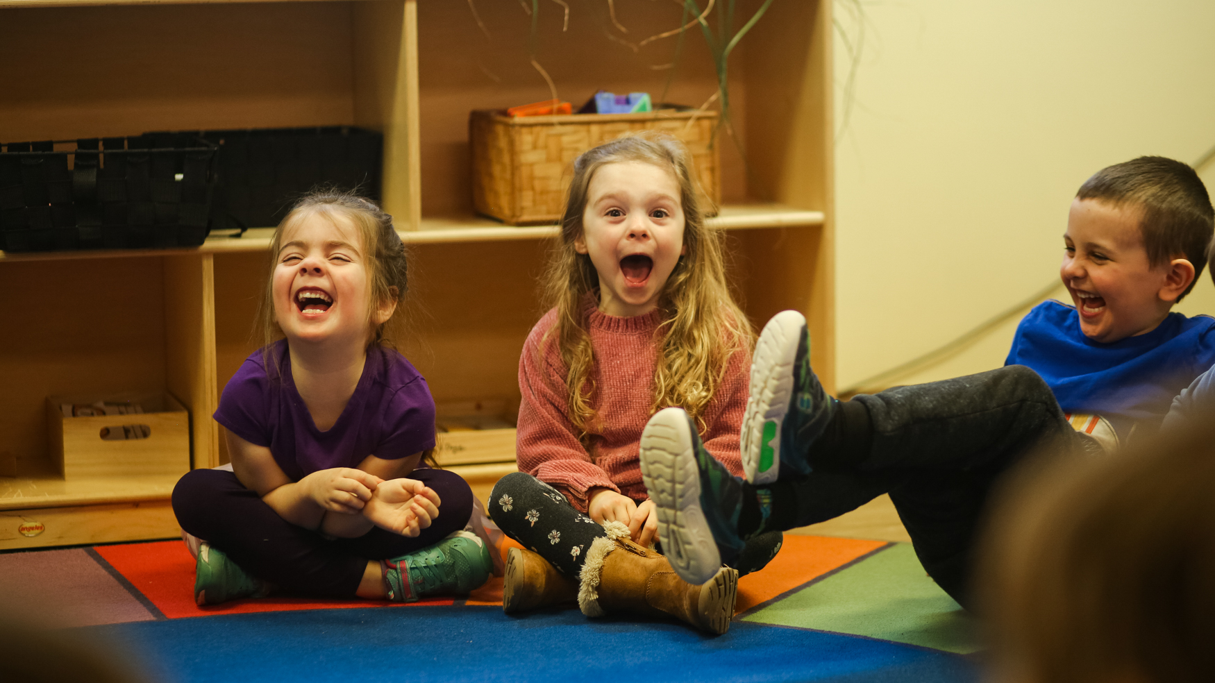 A group of children sitting in a circle in a Christian school classroom.