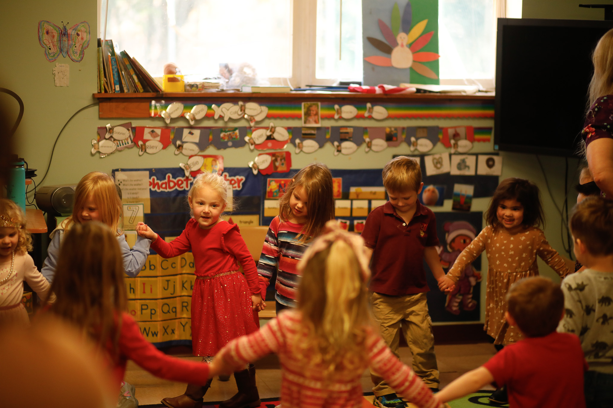 A group of children in a classroom.