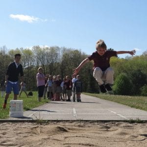 AP Physics students teach 2nd graders about the physics of the long jump.
