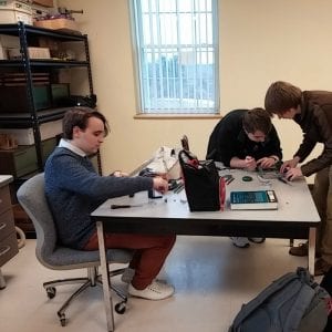 Upper School students work in the robotics lab.